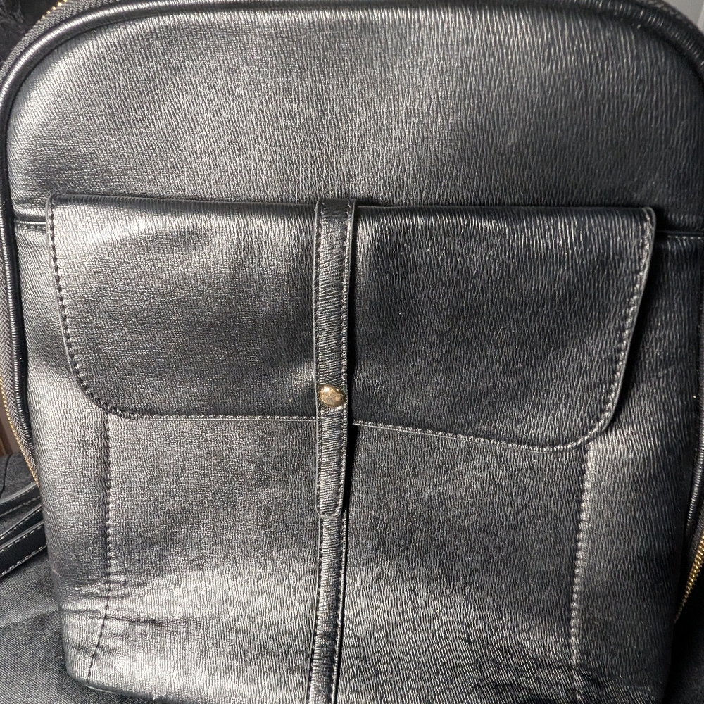 Mystique Black leather backpack with gold accents